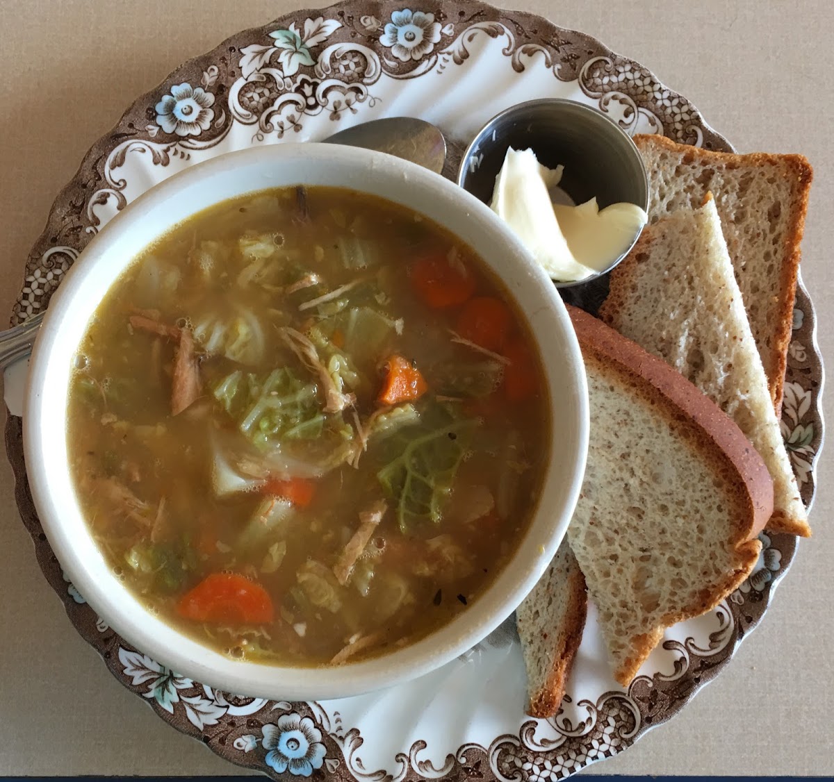 Bowl of Chicken, Cabbage and Jalapeño Soup with gluten free bread.