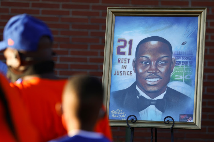 A portrait of Ahmaud Arbery, an unarmed young Black man shot and killed after being chased by a white former law enforcement officer and his son, is pictured during a candle light vigil to mark the one year anniversary of his death, at New Springfield Baptist Church in Waynesboro, Georgia, US February 23, 2021.