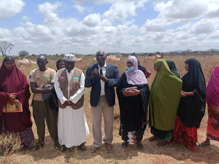 CIFA's board treasury Hajj Ibrahim Oshe joined by beneficiaries of camel's distribution at Yaballo Moyale on Tuesday