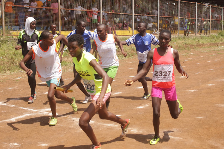 Mary Kwamboka receives the baton during the women's 4x400m relay at Moi Stadium in Kisumu