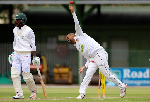 Lesiba Ngoepe of the Warriors (L) and Robin Peterson of VKB Knights during day 1 of the Sunfoil Series match between Warriors and VKB Knights at St Georges Park on November 03, 2016 in Port Elizabeth, South Africa.