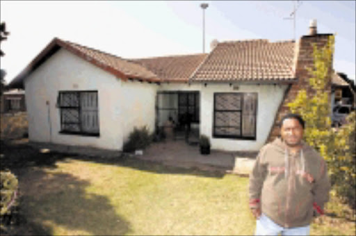 NOT FAIR: Daniel Mollo in front of the house that is no longer his. Pic. Elvis Ntombela. 20/07/2009. © Sowetan. 20090720 Dan Mollo from Katlaping section in Tembisa, Ekurhuleni Gauteng in front of his house, Mollo is in battle with a financial instutuition over his house and a loan. PHOTO: ELVIS NTOMBELA