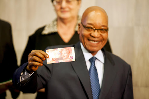 President Jacob Zuma holding a R50 note. File photo.