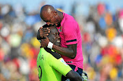 Black Leopards' players Rotshidzwa Muleka, left, and Jean Munganga celebrate winning promotion back to the Premiership.