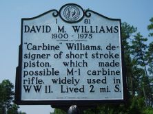 "Carbine" Williams, designer of short stroke piston, which made possible M-1 carbine rifle, widely used in WWII. Lived 2 mi. S.Plaque via North Carolina Highway Historical Marker Program, and is...