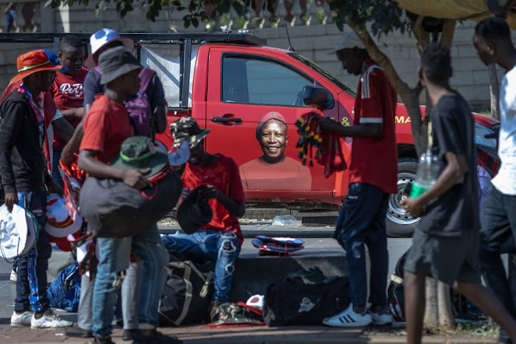 A vehicle featuring a picture of EFF leader Julius Malema behind street vendors during a national protest organised by the EFF, March 20 2023. Picture: GUILLEM SARTORIO/BLOOMBERG