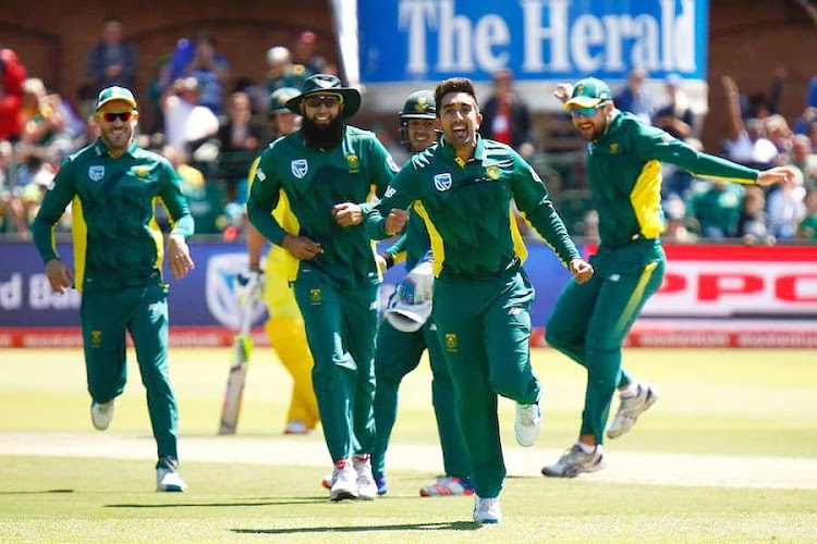 South African players celebrate with Tabraiz Shamsi after the left-arm unorthodox took a wicket during the first of the five-match ODI matches between South Africa and Sri Lanka on Sunday July 29 2018 in Dambulla, Colombo.