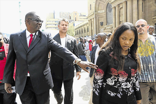 Zwelinzima Vavi and his wife, Noluthando, during a break in proceedings at the Johannesburg High Court, where he was fighting to overturn his suspension. File photo