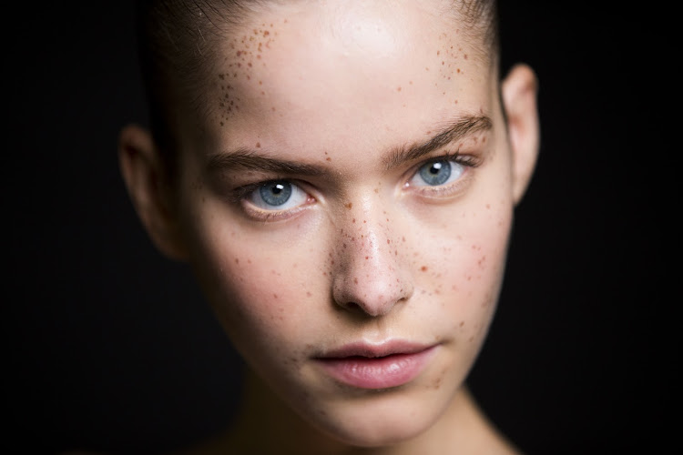 The most natural placements for faux freckles are across the bridge of the nose with a light sprinkling on the forehead.