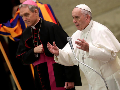 Pope Francis talks as he leads the general audience in Paul VI Hall at the Vatican December 7, 2016. /REUTERS