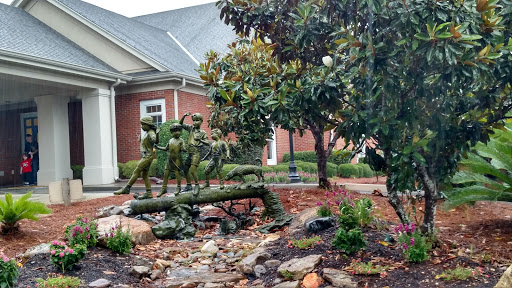 Children Playing on Log Statue