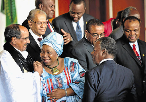 AU Commission chairman Nkosazana Dlamini-Zuma holds hands with Sahrawi President Mohamed Abdelaziz in Addis Ababa, Ethiopia