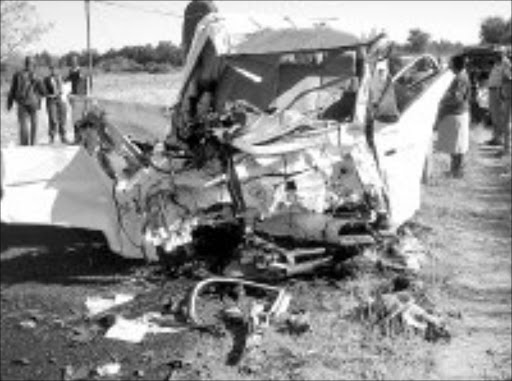 WRECKAGE: Police at the accident scene in Limpopo yesterday. The crash happened between Hoedspurit and Acornhoek. © Sowetan.