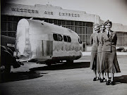 Women pose near one of the first Bowlus trailers, built in the 1930s. One early use was transporting plane crews. 