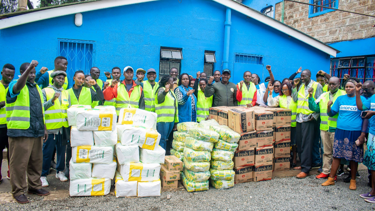 Representatives of 12 CBOs that collaborated with SHOFCO in distributing foodstuffs to flash floods victims in Kibera. The organisation has partnered with 40 CBOs to distribute foodstuffs to families affected by floods in Nairobi.