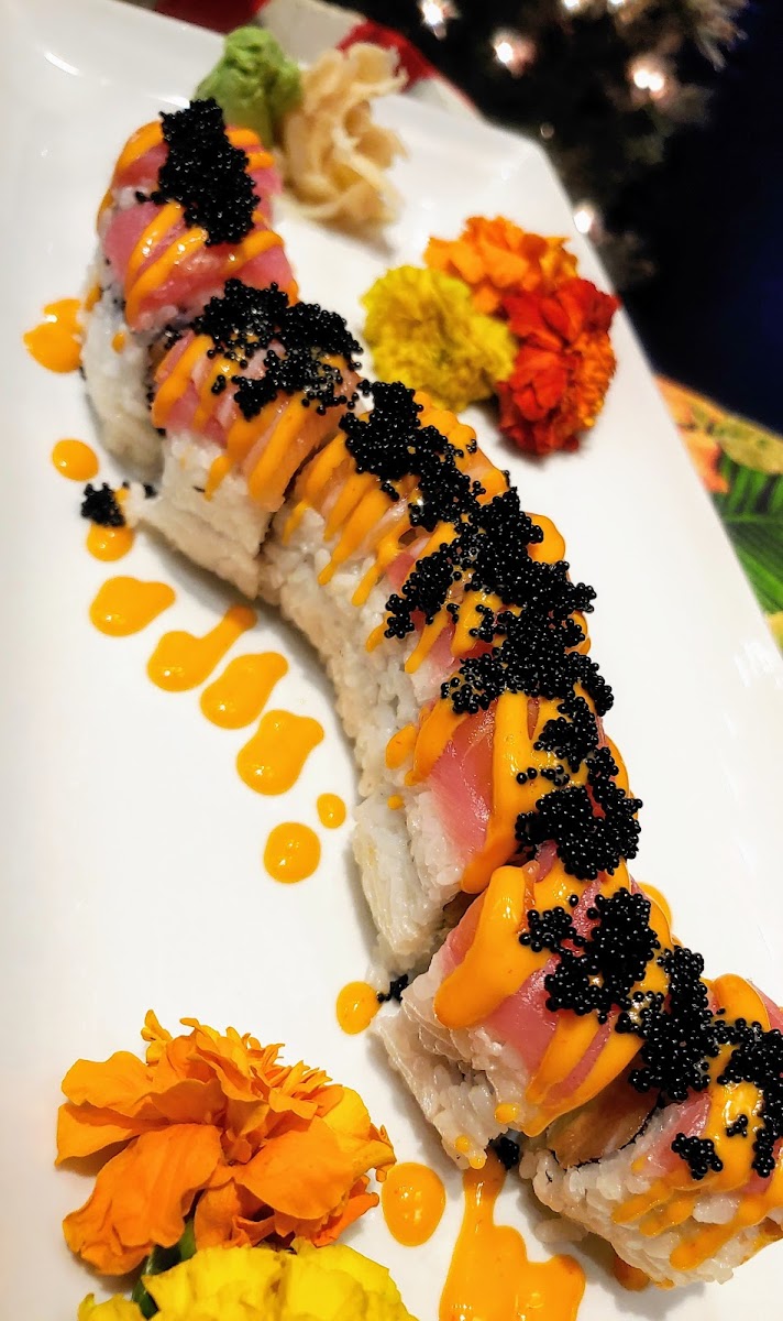 Sushi rice | salmon | avocado | cream cheese | TOPPED w tuna &  salmon | spicy creamy Sriracha aioli | black tobiko.

ALL SUSHI ROLLS MUST REQUEST GF SOY SAUCE ON ALL SUSHI ORDERS!!!