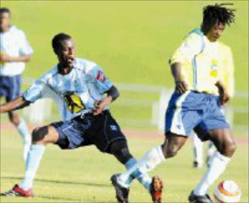 WRONG WAY: Mamelodi Sundowns' Clement Mazibuko dribbles past Benoni United's Beauford Tshabalala during their PSL match at Germiston Stadium yesterday. Pic. Antonio Muchave. 13/05/2007. © Sowetan.