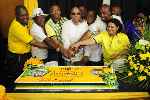 ANC leaders cutting the organization's 104th birthday celebration cake in Rustenburg ahead of the big celebration at Royal Bafokeng Stadium. Photo Thulani Mbele.