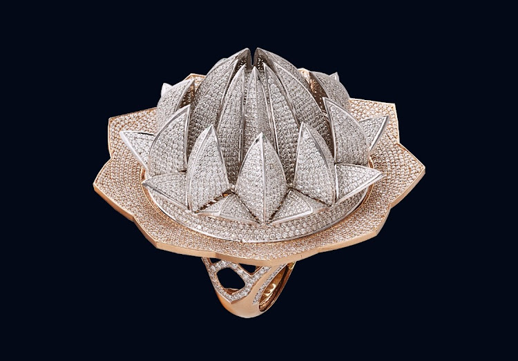 It took a team of 12 artisans 18 months to create the Lotus Temple Ring.