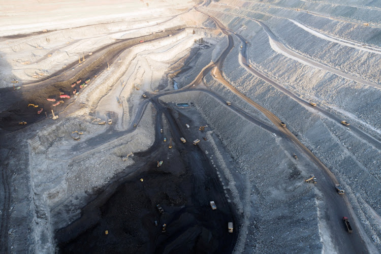 An aerial view shows machinery working in an open-pit coal mine in Ejin Horo Banner, Ordos, Inner Mongolia Autonomous Region, China. File photo: CHINA DAILY via REUTERS