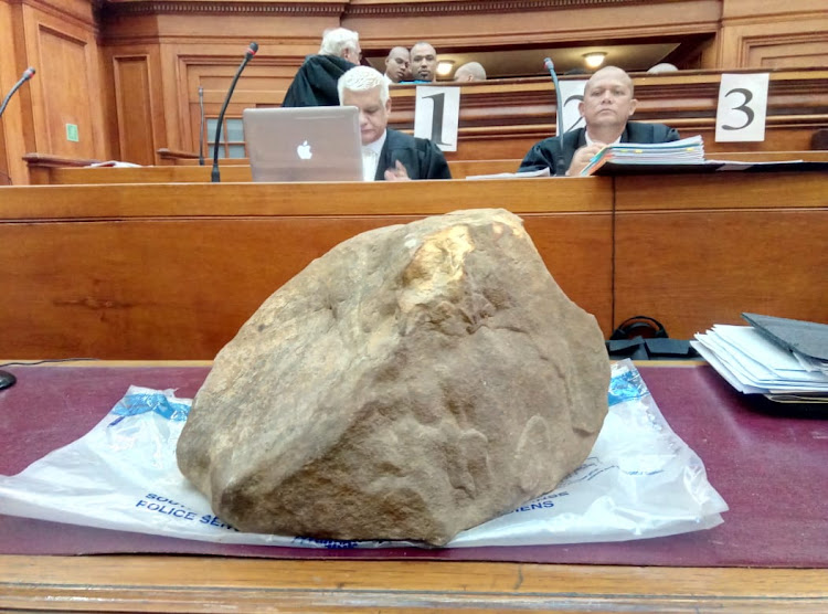 The rock used to kill Hannah Cornelius, displayed in the high court in Cape Town during the murder trial of four defendants on October 16 2018