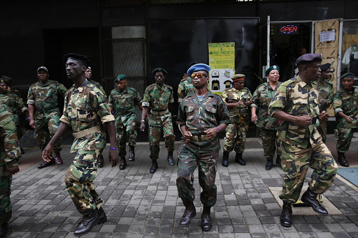 MK veterans wearing camouflage uniforms lined up outside Luthuli House to "protect" it from protesters calling on President Jacob Zuma to quit on 7 April 2017.