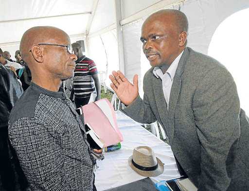 MUCH AT STAKE: Thandisizwe Mtirara (left) and younger brother Daludumo Mtirara, leaders of the two sides, exchange words Picture: LULAMILE FENI