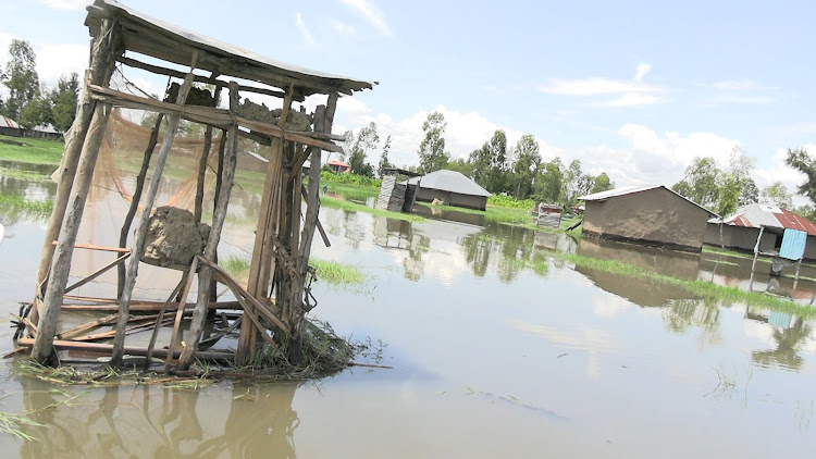 A pit latrine and homes marrooned by floods in Nyando subcounty, Kisumu, May 4, 2024.