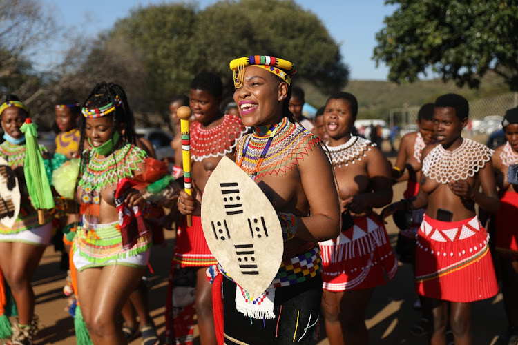 Zulu maidens await the arrival of the body of the Zulu Queen Mantfombi Dlamini Zulu.