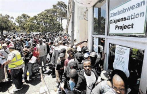 ANXIETY: Zimbabweans stand in a queue at the Department of Home Affairs in Wynberg, Cape Town PHOTO: ESA ALEXANDER