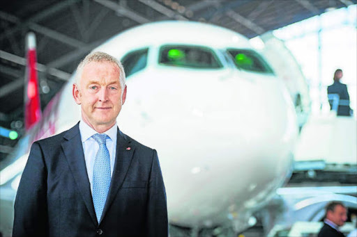 NEW ORDER : Swiss International Airlines’s Thomas Kluehr at a media presentation of the Swiss International Air Lines’ new Bombardier CS 100 passenger jetliner It was the firstoll-out of the Canadian Bombardier Commercial Aircraft’s new jetliner C-Series Picture: AFP