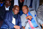 Former president Jacob Zuma and Rivers of Living Waters Ministries Bishop Bafana Stephen Zondo chat during Zuma's visit to the church. 