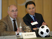 AFC Ajax's president Michael Van Praag (L) and Paris Saint German's president Laurent Perpere. Van Praag van Praag became the fourth man to challenge Sepp Blatter for the FIFA presidency when he joined the race on Monday 26 January 2015, saying it was time to bring soccer's governing body back to normal.