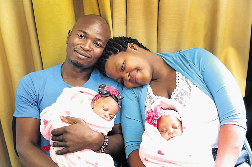 HAPPY ENDING: Mbongeni Sihlongonyane and Bongekile Simelane with their twins Uwenzile and Uyihlelile after the conjoined girls were separated during a two-hour operation.