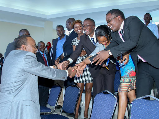 President Uhuru Kenyatta with students of Zetech University Complex during the official opening of the facility in Ruiru, Kiambu county. Photo/PSCU