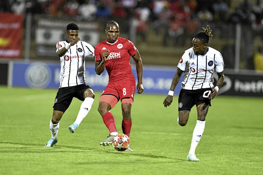 Vincent Pule of Orlando Pirates and Mlungisi Mbunjana of Highlands Park fights for the ball during their Absa Premiership match at at Makhulong Stadium last night.
