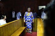 Nosiviwe Mapisa-Nqakula entering the Pretoria magistrate's court on Thursday in connection with corruption and money laundering charges.