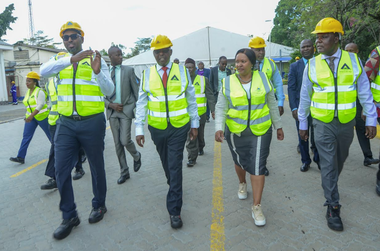 EAPC acting MD Mohamed Osman, Board Chairman Retired Brigadier Richard Mbithi, Investment,Trade and Industry CS Rebecca Miano and Industry PS Juma Mukhwana during a tour of the recommissioned EAPC factory in Athi River/ HANDOUT