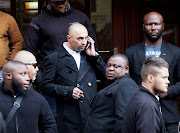 Nafiz Modack and his bodyguards outside the Cape Town regional court during his extortion trial. Modack claimed he had received a threatening and abusive phone call from an unknown number.
