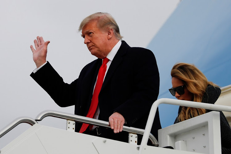US President Donald Trump and First Lady Melania Trump descend from Air Force One at Joint Base Andrews in Maryland in the US on December 31 2020. Trump is continuing to claim he lost to Democrat Joe Biden due to voter fraud.