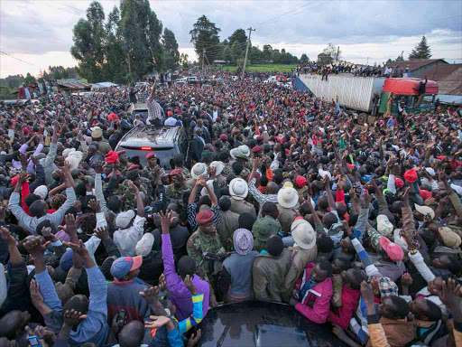 President Uhuru Kenyatta and Deputy President William Ruto addressing residents of Koiwa after he officially launched the upgrading to Bitumen standard of Tengecha-Koiwa-Sotit-Changoi road in Bomet County. /PSCU