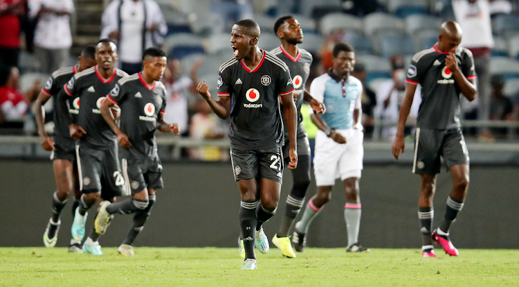 Orlando Pirates defender Tapelo Xoki celebrates scoring from a penalty with his teammates in their DStv Premiership win against SuperSport United at Orlando Stadium in Soweto.