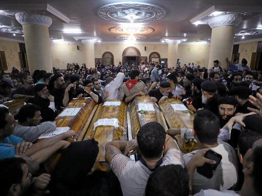 Mourners gather at the Sacred Family Church for the funeral of Coptic Christians who were killed on Friday in Minya, Egypt, May 26, 2017. /REUTERS