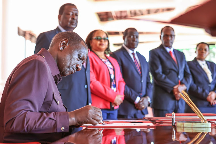 Presidetn William Ruto assenting to the County Governments Additional Allocation Bill in State House, Nairobi on March 4, 2024.