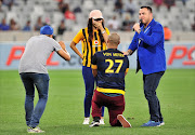 A Kaizer Chiefs fan proposes to his girlfriend at halftime during the Absa Premiership 2016/17 game between Cape Town City and Kaizer Chiefs at Cape Town Stadium on 25 April 2017.
