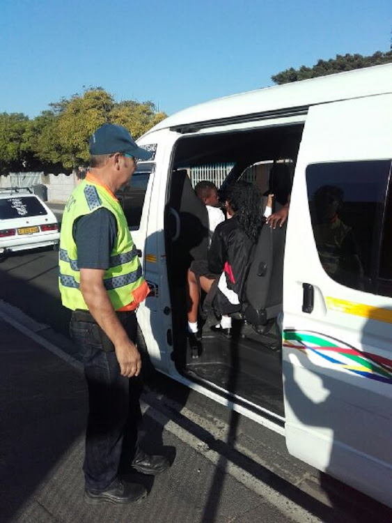 Twenty-eight children crammed into a 16-seater taxi were escorted to school by a traffic officer in Cape Town on Wednesday.