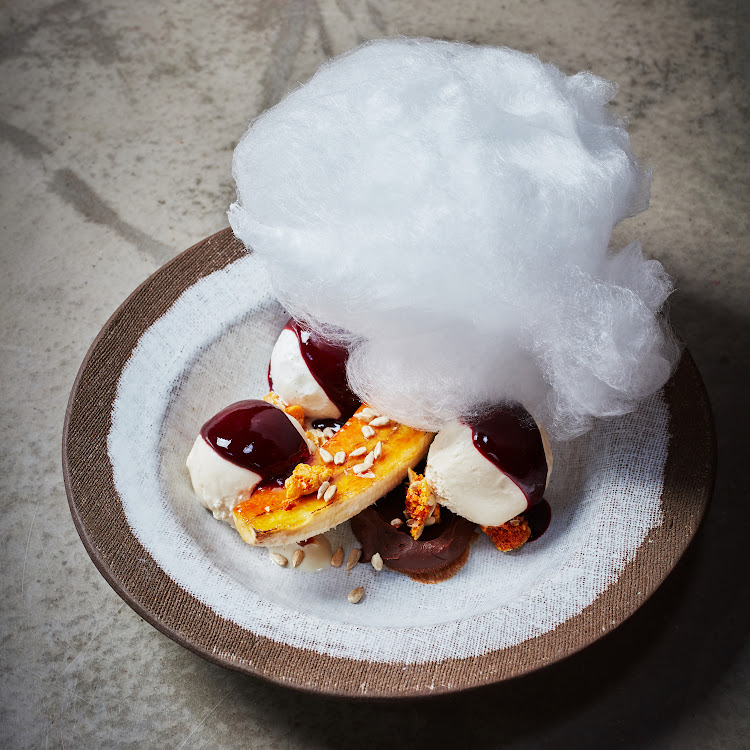 Banana split brulee with banana salted caramel, a berry glaze ice cream and candy floss.