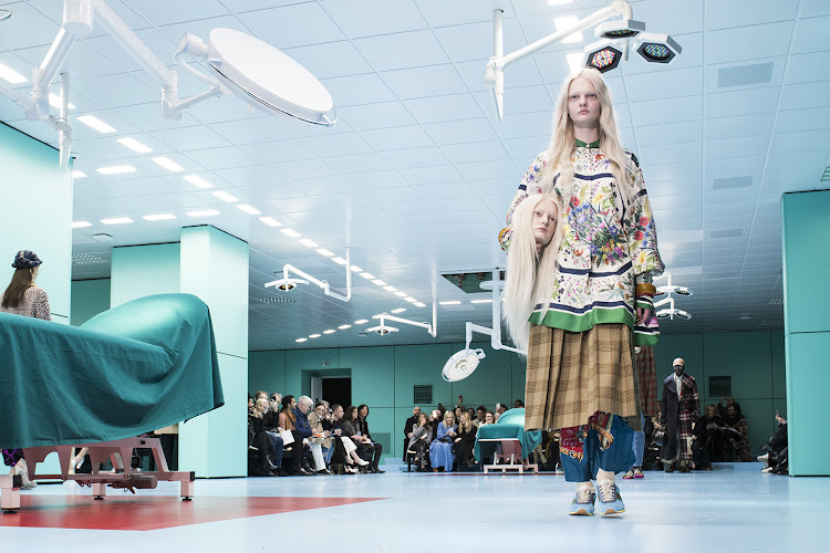 Alessandro Michele had drawn on a “post-human” Gucci cyborg to find his theme — and staged his show in a brutal, overlit surgical theatre