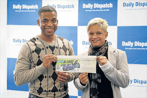 SEPTEMBER 09, 2016 Sbu Ngalwa and Peugeot/Citroen General Manager Shakiera Haupt with the winning ticket Picture: MARK ANDREWS © DAILY DISPATCH