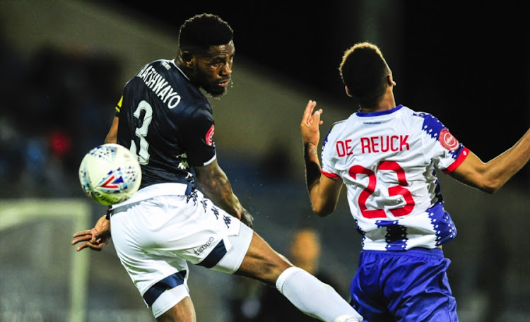 Bafana Bafana and Bidvest Wits captain Thulandi Hlatshwayo challenges for the ball in the air against Rushine De Reuck of Maritzburg United during an Absa Premiership match at Harry Gwala Stadium on September 15, 2018 in Pietermaritzburg.